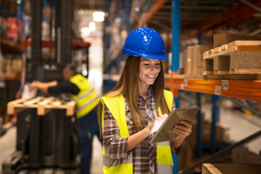 Warehouse worker using a digital tablet